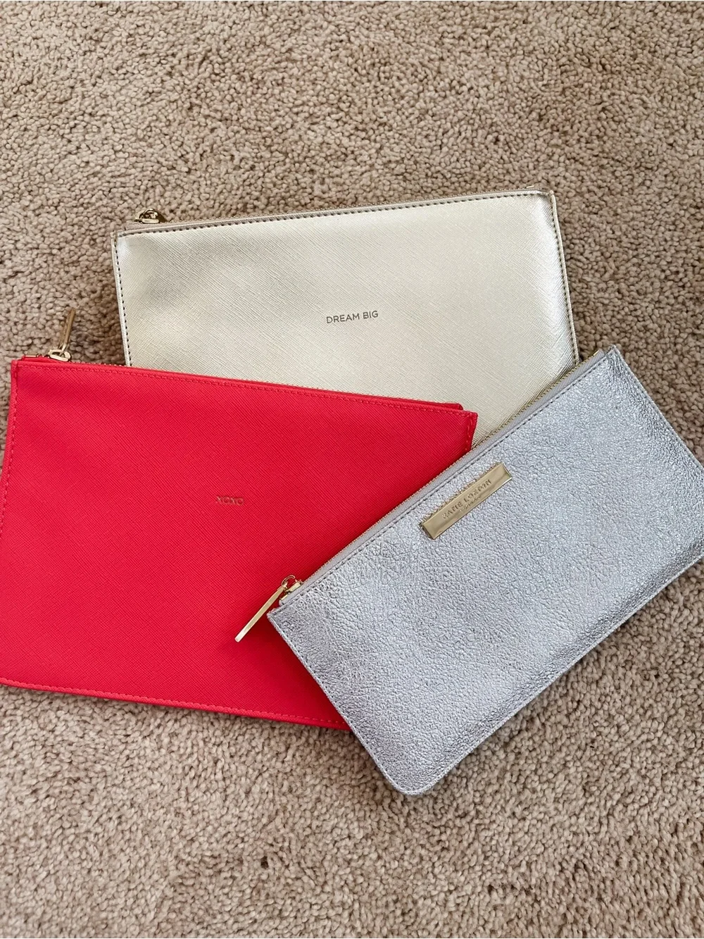 Set of three flat pouches by Estella Bartlett and Katie loxton